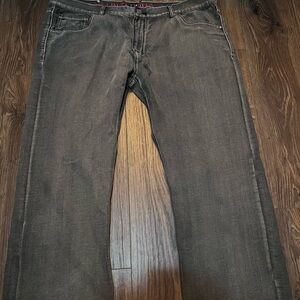 Grey and black jeans with red pockets